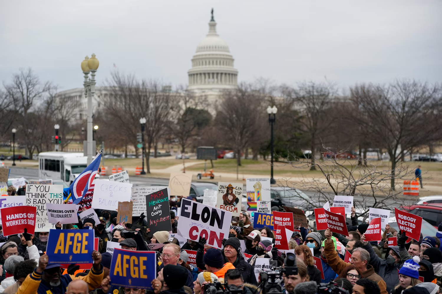 Demonstrators rally during a protest against U.S. President Donald Trump and the actions he has taken in the first weeks of his presidency, outside of the Department of Labor (not pictured) in Washington, U.S., February 5, 2025.