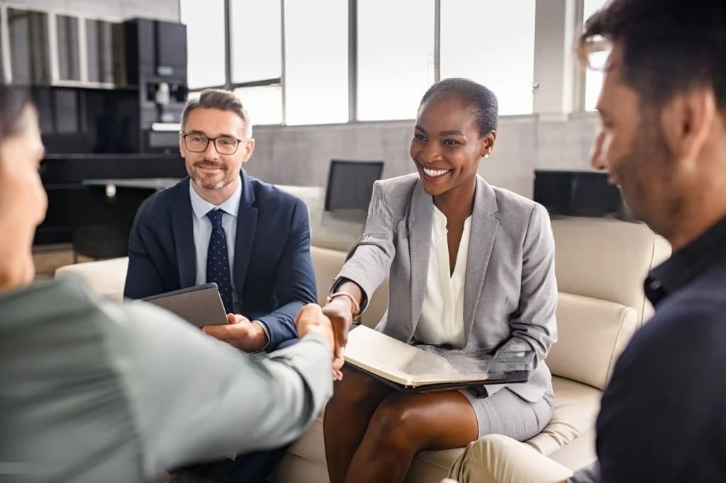 Senior Leadership Executives meet in an office setting.