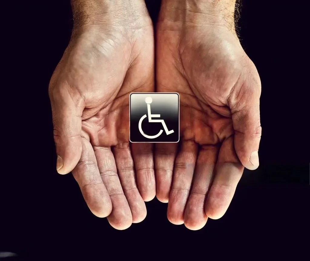 Overhead view of disabled badge in hands