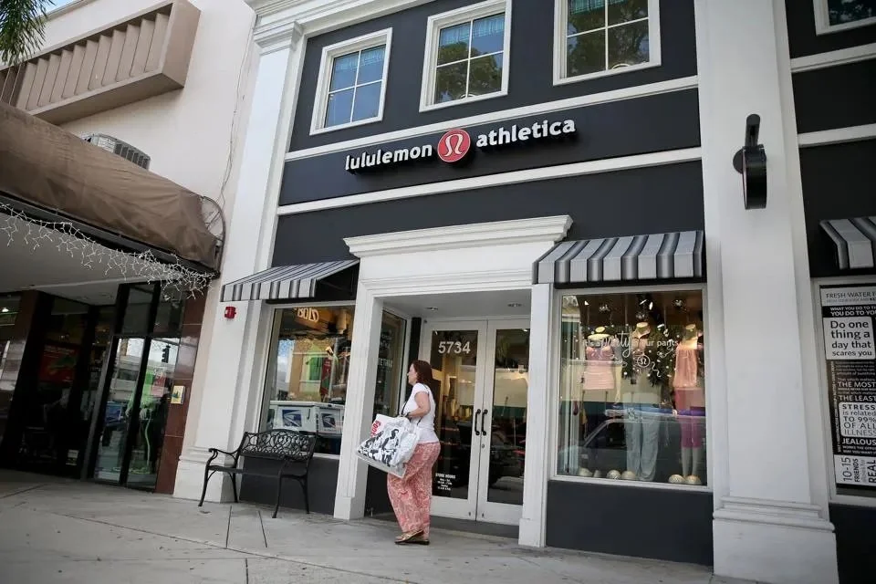A woman walks past a Lululemon Athletica store on December 10, 2013 in Miami, Florida.